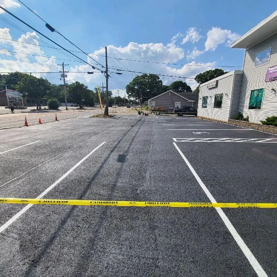 Different types of pavement markings in a Rhode Island parking lot